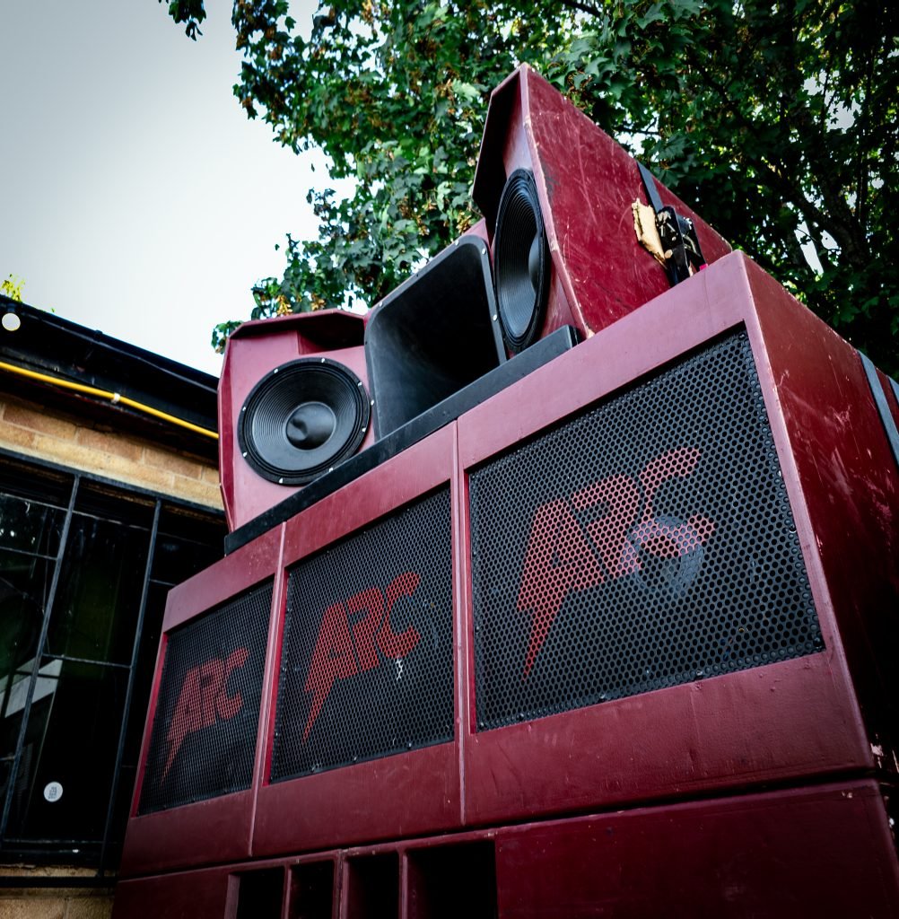 A red sound system stack outside Dryad Works, Sheffield