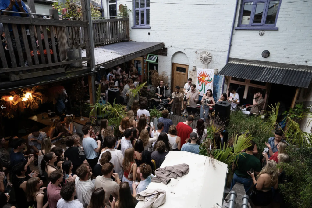 A crowd watching a band play in the courtyard at Hagglers Corner, Sheffield
