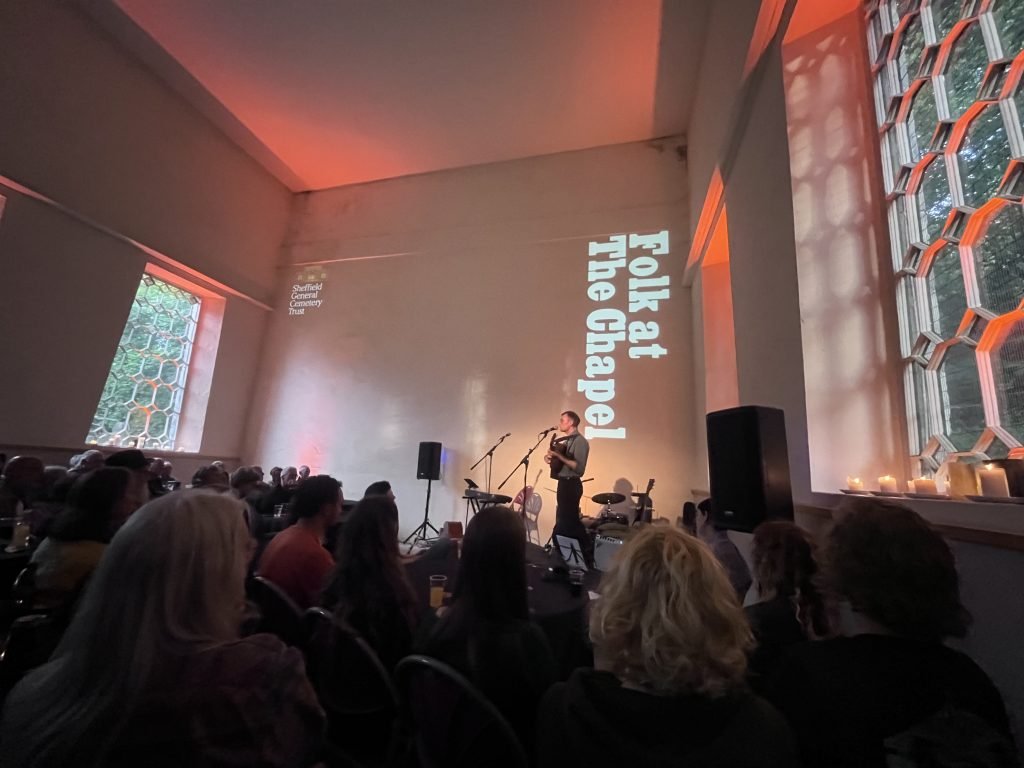 A guitarist performing at Folk at the Chapel, Samuel Worth Chapel, Sheffield