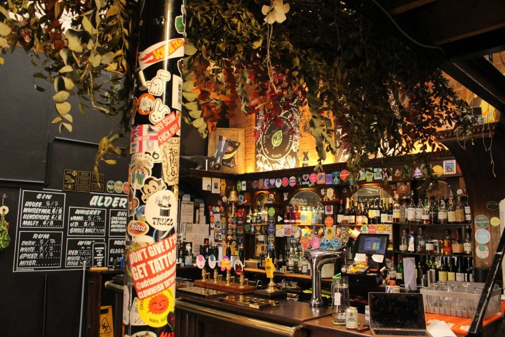 The sticker-covered bar at Alder, Sheffield